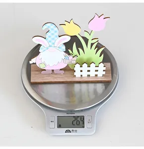 Detailed view of 26.4g lightweight Easter gnome wooden table ornament with tulips