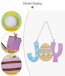 Detail view of wood JOY Easter ornament with colorful patterns and pom-pom textures