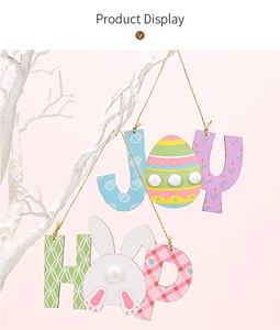 Easter JOY and HOP wooden signs with bunny tails and pastel eggs on white branches