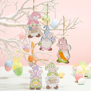 Detail of colorful wooden Easter gnome pendants hanging on a branch with bunny ears