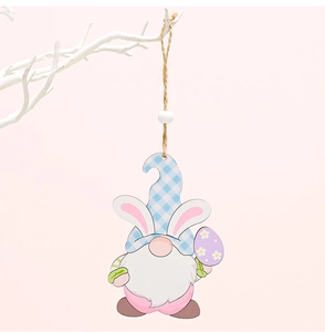 Detail of wooden Easter gnome pendant with bunny ears and purple egg on white branches