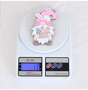 Easter gnome wooden pendant with pink bunny hat weighing 13g on a scale