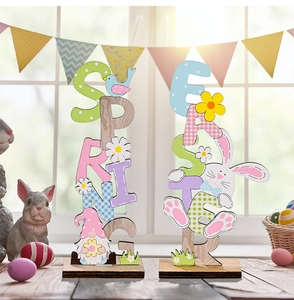 Close-up of Easter and Spring wooden letter signs with colorful floral and bunny motifs