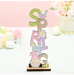 Detailed view of SPRING wooden sign with colorful letters, bird, and cute gnome ornament