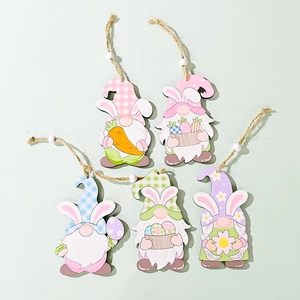 Set of five Easter wooden gnomes with rabbit ears holding carrots and colorful eggs