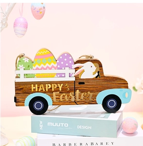 Detail of wooden Happy Easter car ornament with painted eggs and rabbit on pink background