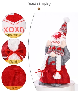 Detail display of Valentine gnome doll with heart envelope and knit hat craftsmanship