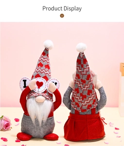 Detail of Valentine Gnomes with knitted heart hats holding I Love U sign on pink background