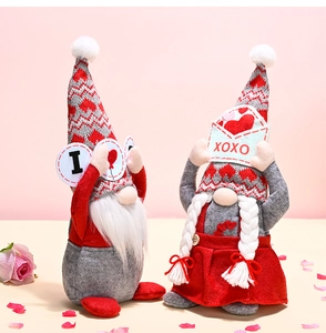 Detail view of Valentine's Day gnomes with heart patterns and XOXO envelope design
