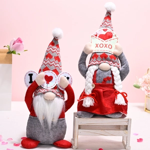 Valentine's Day faceless gnome dolls with I Love U sign and XOXO envelope on pink petals