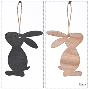 Detail of wooden Easter bunny pendant showing black painted and natural wood grain sides