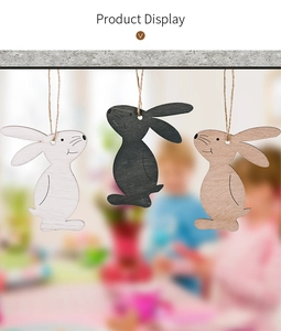 Detail of wooden Easter bunny pendants in white, black and natural wood with hemp ropes
