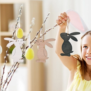 Easter wooden bunny ornaments set in white, brown and black hanging on spring branches