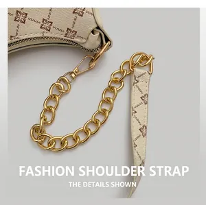 Detail view of the vintage monogram shoulder strap with gold chain and metal buckle