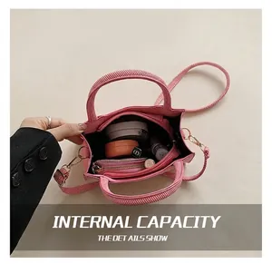 Top view of pink woven crossbody bag showing interior capacity with zipper pocket
