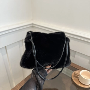 Chic black faux fur shoulder bag with leather straps for minimalist autumn winter style