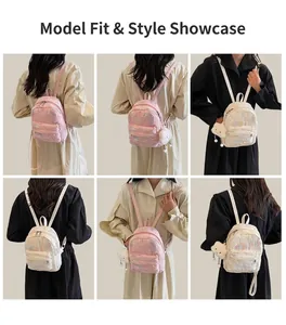 Mini pink and white quilted backpack with colorful embroidery and cute cloud charm