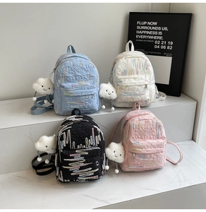 Detailed view of mini backpacks with crinkle texture and cute cloud plush charms