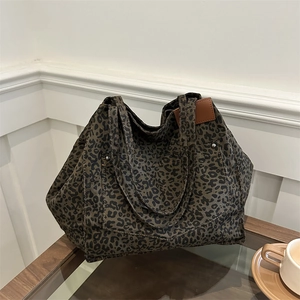 Retro leopard print canvas tote bag with large capacity and stylish front pocket design