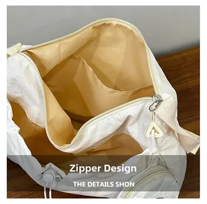 Detailed view of the large canvas tote bag interior with zipper and inner pocket