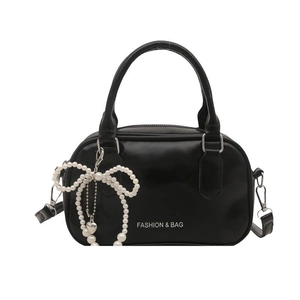 Glossy black bowling handbag with pearl bow charm and Fashion & Bag lettering