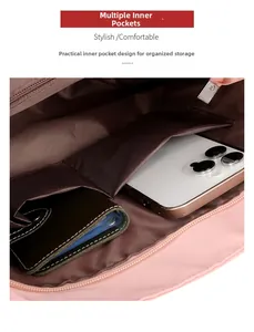Detail of pink nylon tote interior with multiple pockets and secure zipper closure