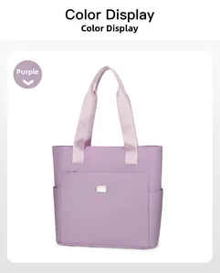 Detail of lavender nylon tote bag with wide webbing handles and front zipper pocket