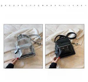 Mini metallic backpacks in silver and black shown with front zipper and thin straps
