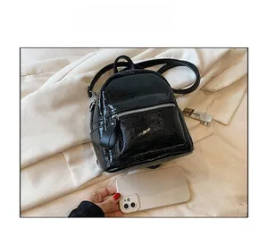 Detailed comparison of mini black crinkled leather backpack with silver zipper pocket