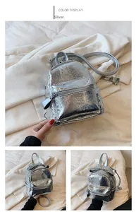 Detail of silver metallic mini backpack with textured finish and adjustable straps