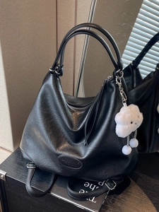 Minimalist black faux leather tote bag with large capacity and fluffy cloud charm