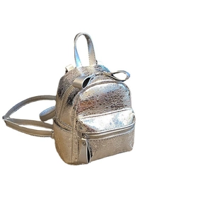 Mini metallic silver backpack for women featuring bow detail and crinkle texture