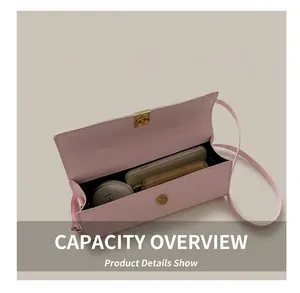 Interior view showing capacity of light pink faux lizard leather baguette shoulder bag