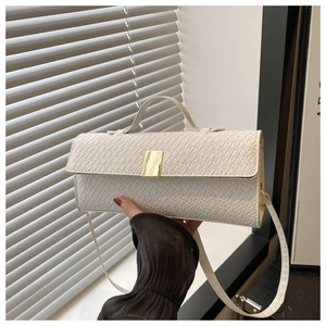 Detailed close-up of white crocodile pattern texture with elegant gold metal buckle hardware