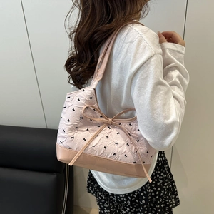 Light pink large tote bag with 3D embossed butterfly patterns and a stylish large bow