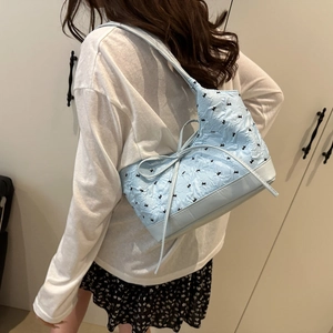 Light blue bubble textured tote bag with cute black bow embroidery for daily commuting