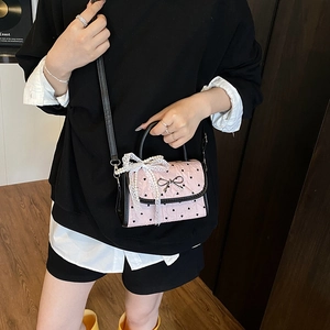 Pink heart-patterned mini crossbody bag with metal bow and lace pearl charms