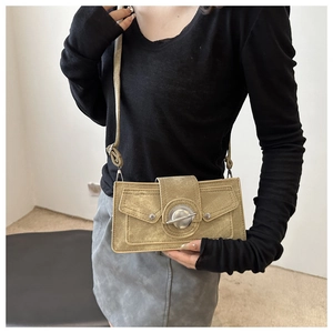 Chic khaki suede crossbody small square bag with silver round buckle worn by model