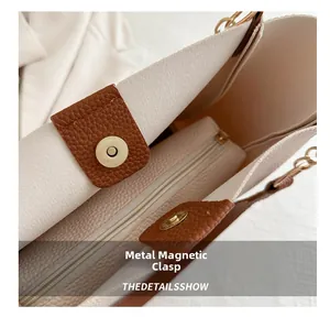 Detail of high-quality magnetic snap closure and textured leather on tote bag interior