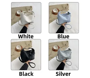 Chic quilted crossbody pillow bags shown in white, blue, black, and silver color options