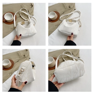 Detailed views of a white textured pillow bag with gold hardware and shoulder strap