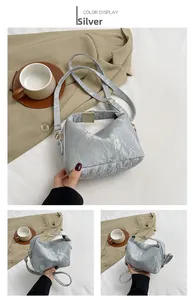 Detail view of the silver pleated pillow bag featuring its unique texture and metallic finish