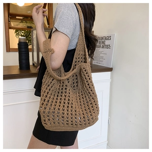 Detail of coffee brown crochet mesh tote bag showing large diamond weave pattern