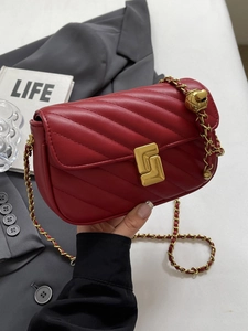 Elegant red chevron quilted leather crossbody bag with gold chain strap and turn-lock