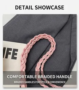 Detail of pink woven vegan leather handle on fashionable tote bag with soft texture