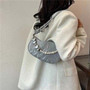 Gray pleated shoulder bag featuring elegant pearl and silver heart chain detail