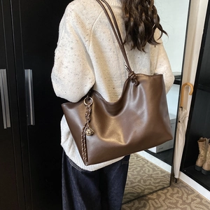Brown large capacity PU tote bag with knotted handles and metal bell charm in retro style
