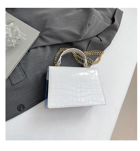 Detailed view of white crocodile pattern PU handbag with elegant golden metal chain strap