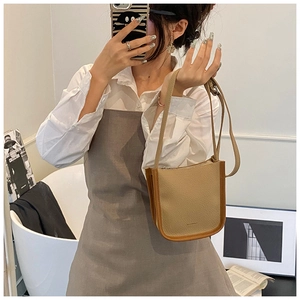 Litchi texture khaki crossbody bag with brown trim and elegant metal zipper details