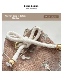 Detail of champagne gold mesh gift bag featuring floral embroidery and woven drawstring